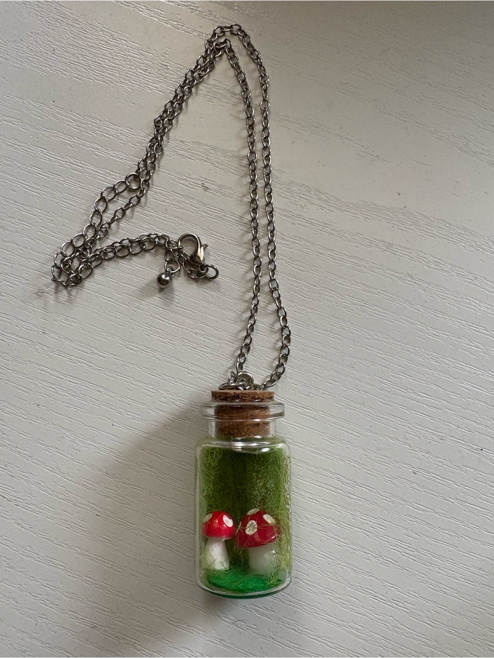 Spencer's Red Mushroom Bottle Necklace with Green Moss